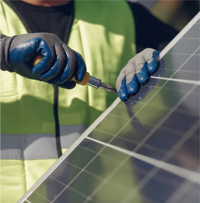 An expert technician from Solartech installing a solar PV panel, highlighting the company’s commitment to professional and high-quality solar PV panel services.